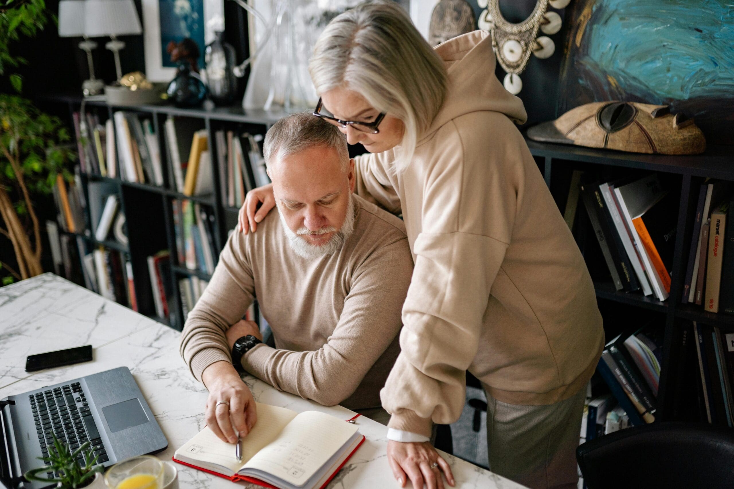 Husband and Wife in their fifties reviewing options and next steps together.