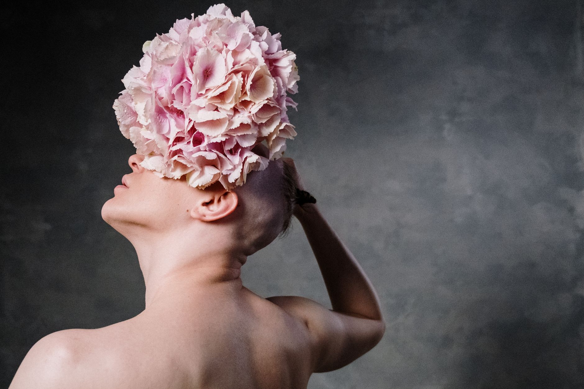Image of woman with flower bloom over her eye to symbolize new beginning and possiblity.